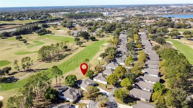 a view of swimming pool with outdoor seating and lake