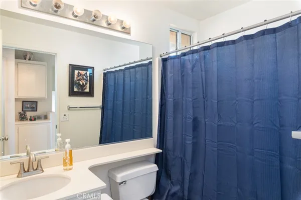 a bathroom with a sink a toilet and tub