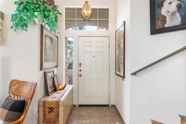 view of living room with furniture and front door