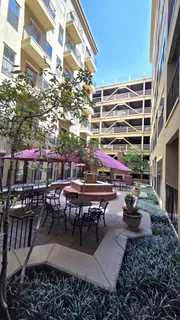 a view of a chairs and tables in the patio