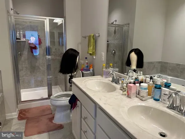 a bath tub sitting next to a white sink