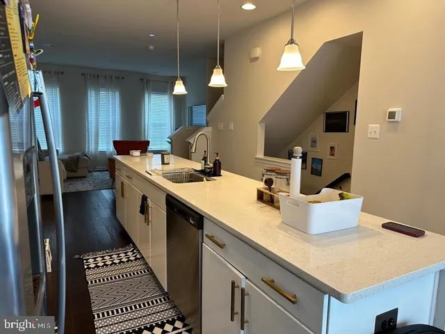 a kitchen with sink and stove