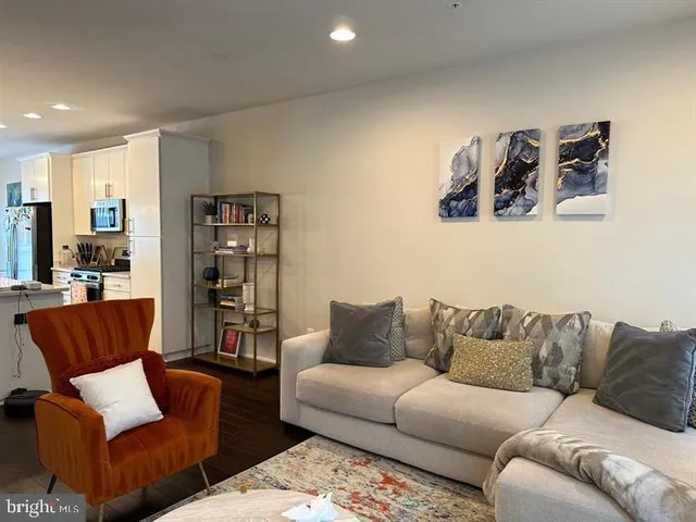 a living room with furniture and walk in closet