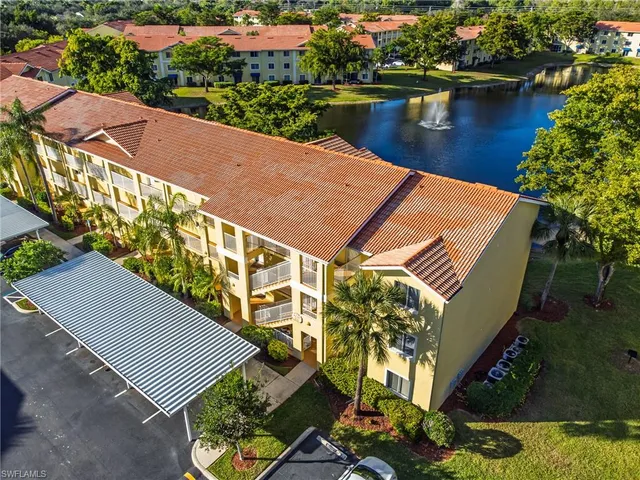 an aerial view of a house with a lake view