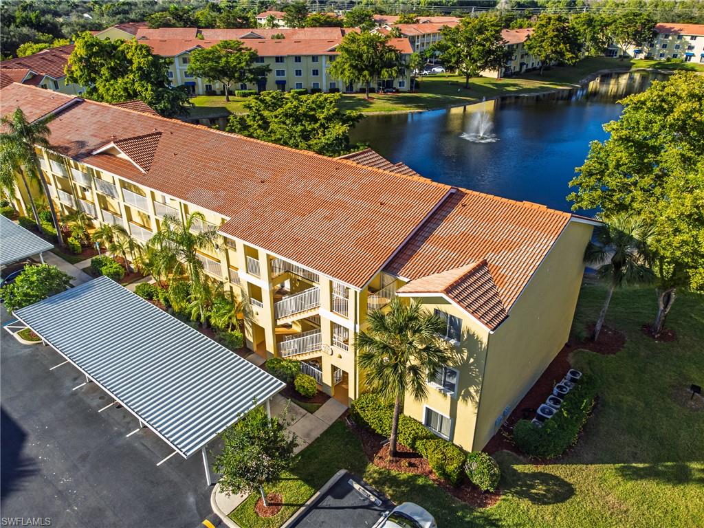 an aerial view of a house with a lake view