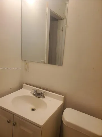 a bathroom with a sink and a toilet