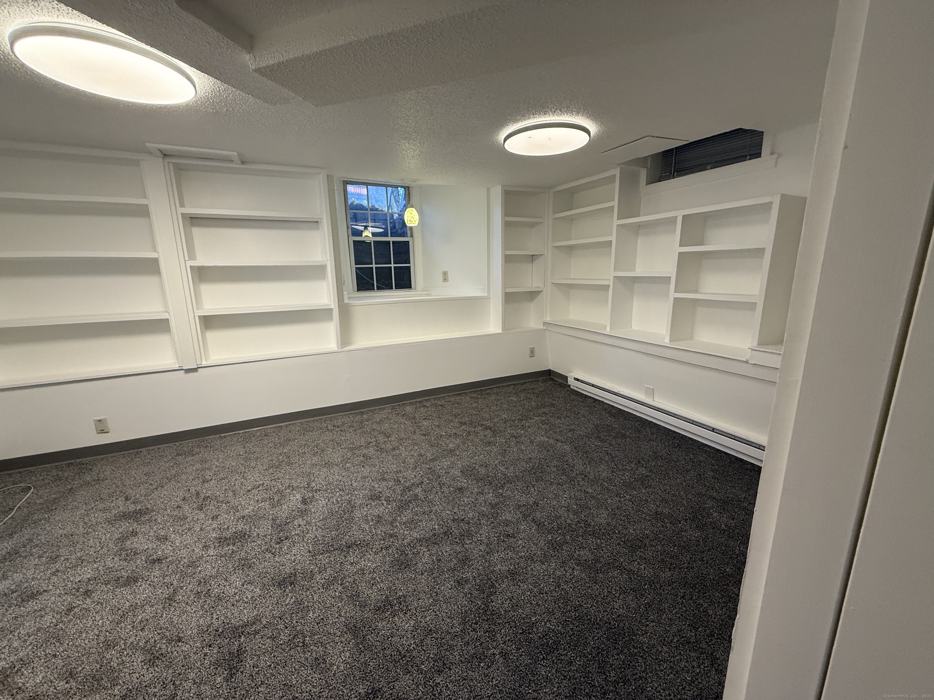 1 1/2 Stetson Street Norwich, CT 06360 - Photo 18 of 29 a view of an empty room with a window