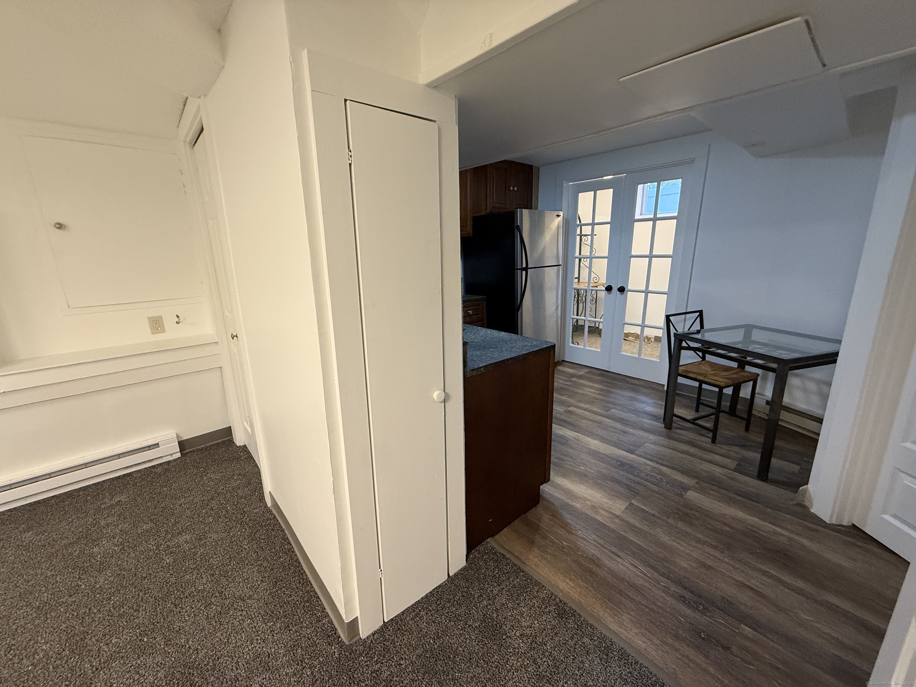 1 1/2 Stetson Street Norwich, CT 06360 - Photo 19 of 29 a view of a kitchen and dining room with wooden floor windows