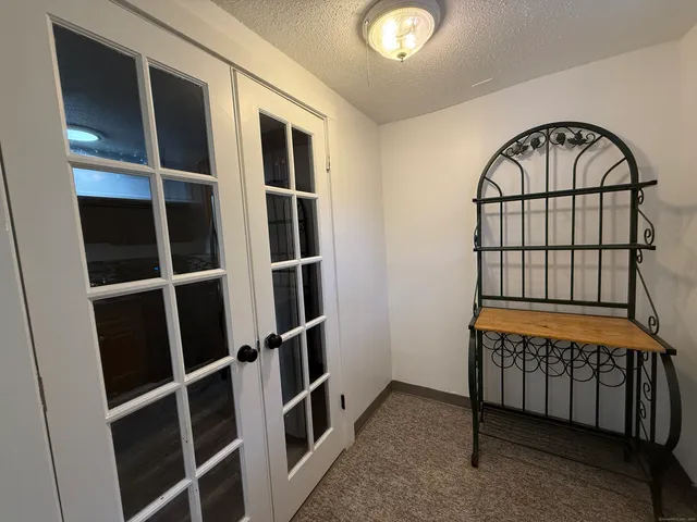 a view of entryway with cabinets