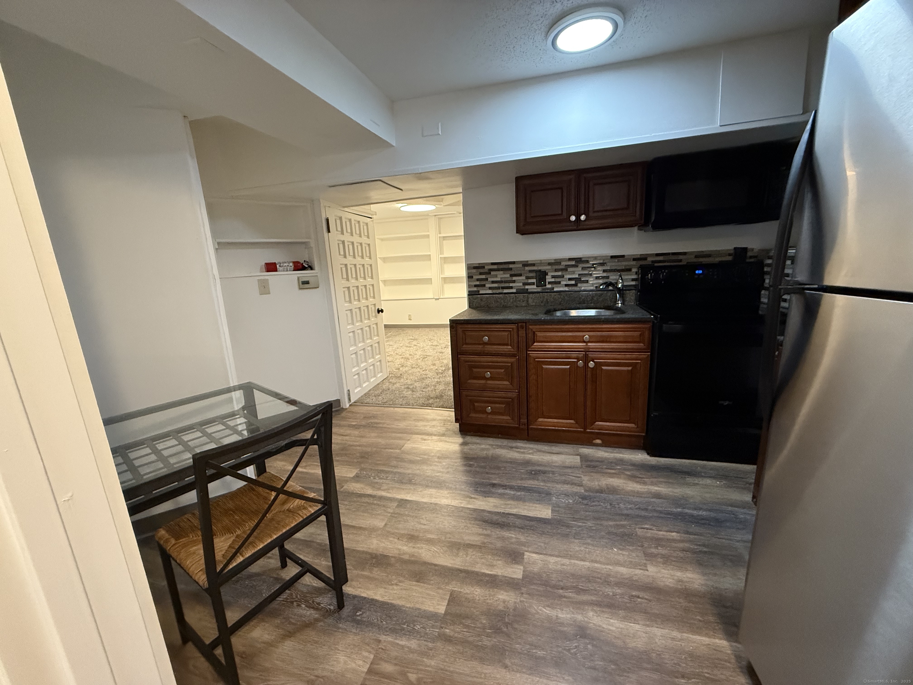 1 1/2 Stetson Street Norwich, CT 06360 - Photo 23 of 29 a kitchen with granite countertop a stove and a refrigerator