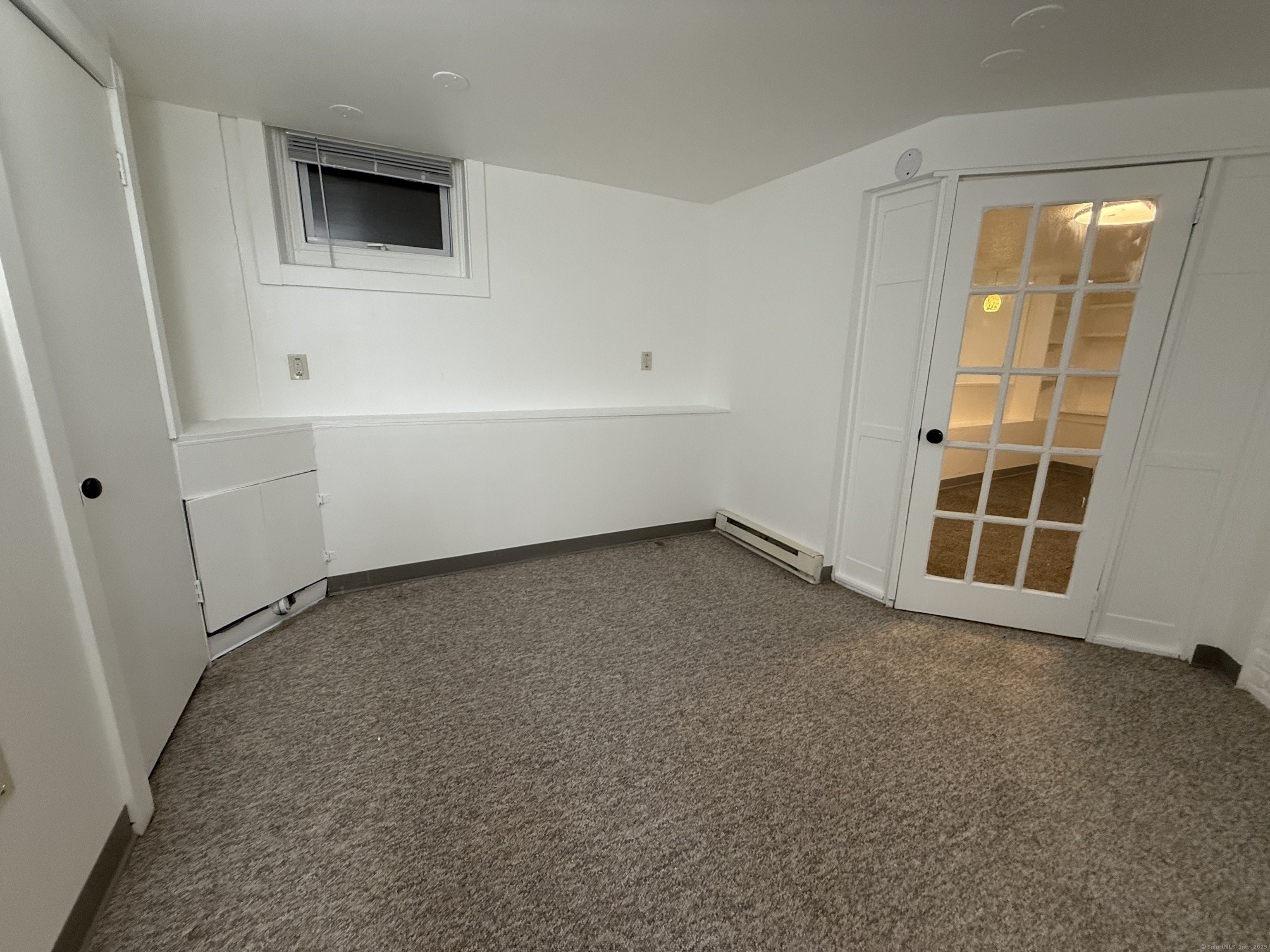 1 1/2 Stetson Street Norwich, CT 06360 - Photo 25 of 29 an empty room with windows