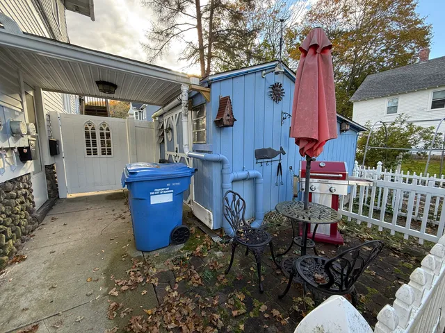 a view of a chairs and table in patio