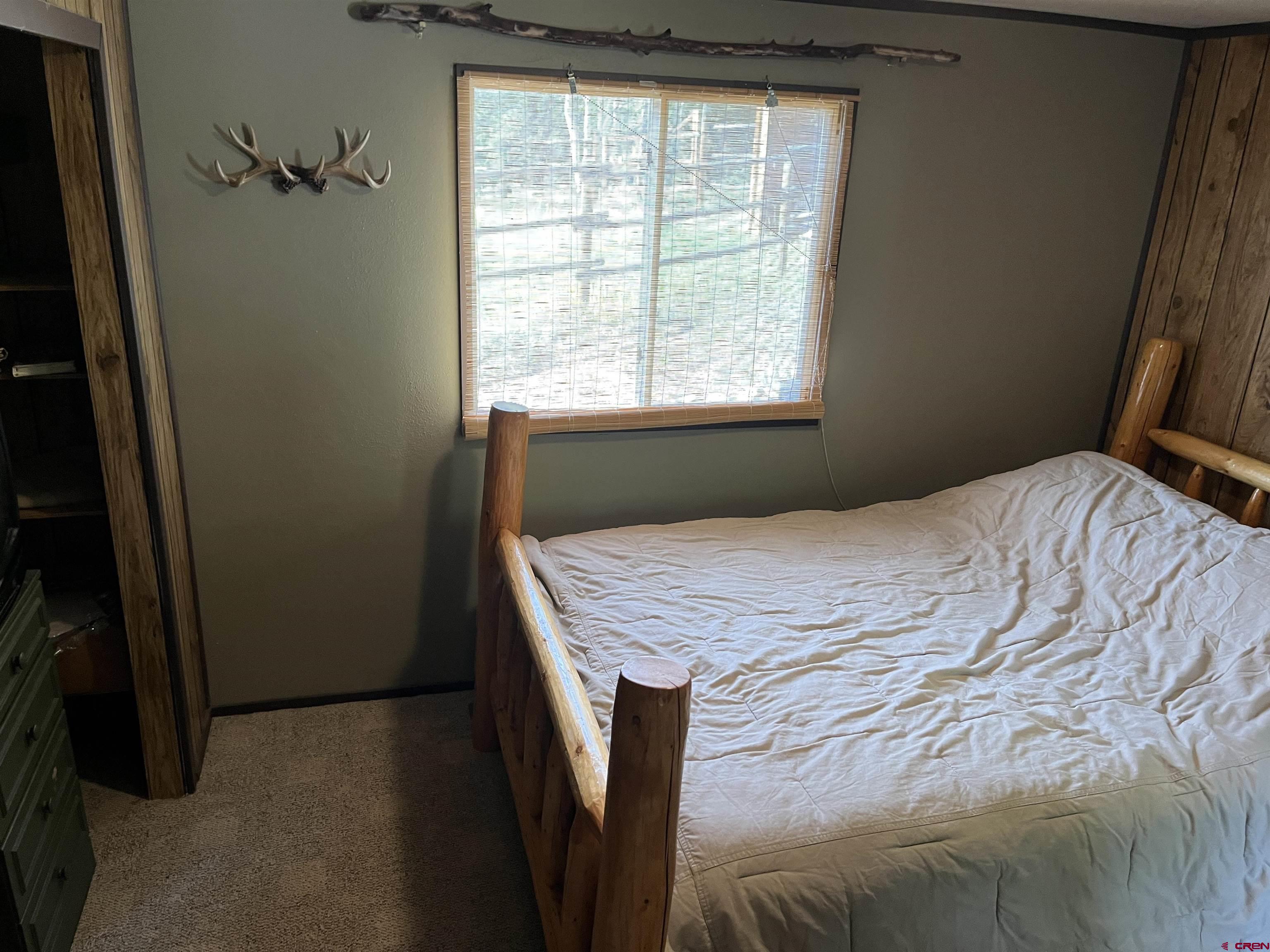 320 Forest Service Road Pitkin, CO 81241 - Photo 7 of 16 a bedroom with a bed and a window