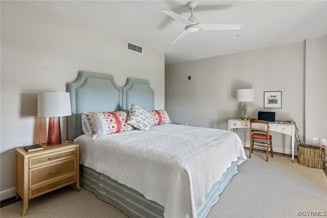 413 Stuart Circle, Unit U5E Richmond, VA 23220 - Photo 11 of 29 a bedroom with a bed and a couch