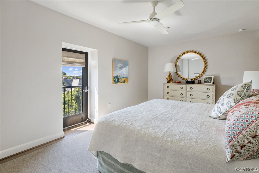 413 Stuart Circle, Unit U5E Richmond, VA 23220 - Photo 12 of 29 a bedroom with a bed window and table