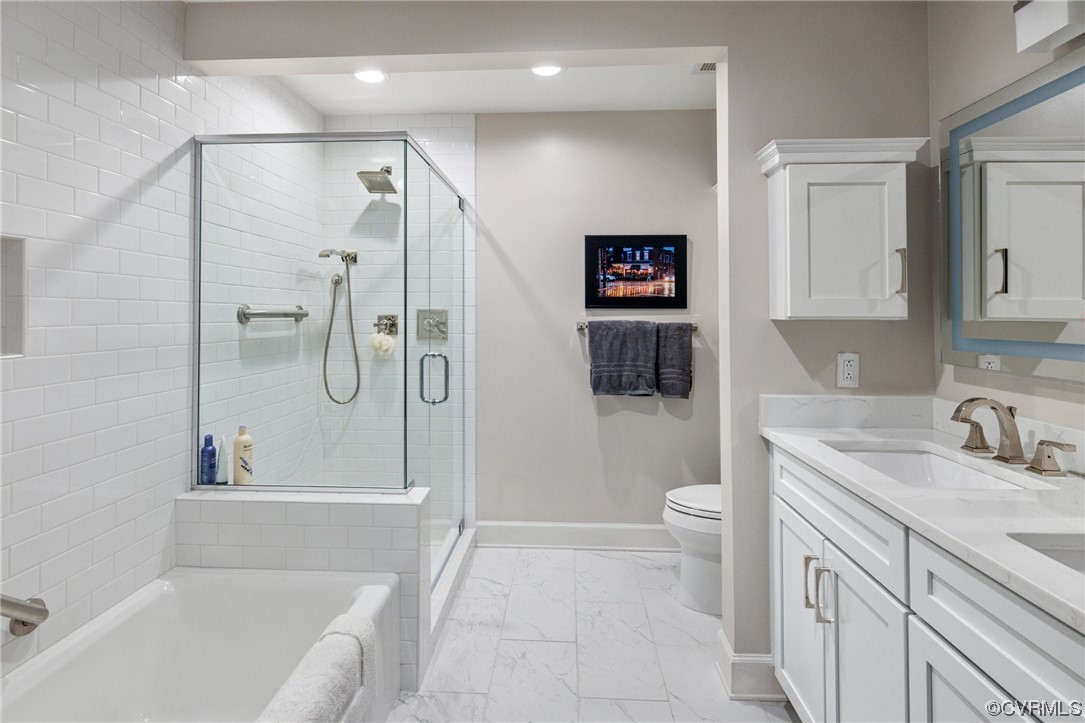 413 Stuart Circle, Unit U5E Richmond, VA 23220 - Photo 14 of 29 a bathroom with a sink a toilet and shower