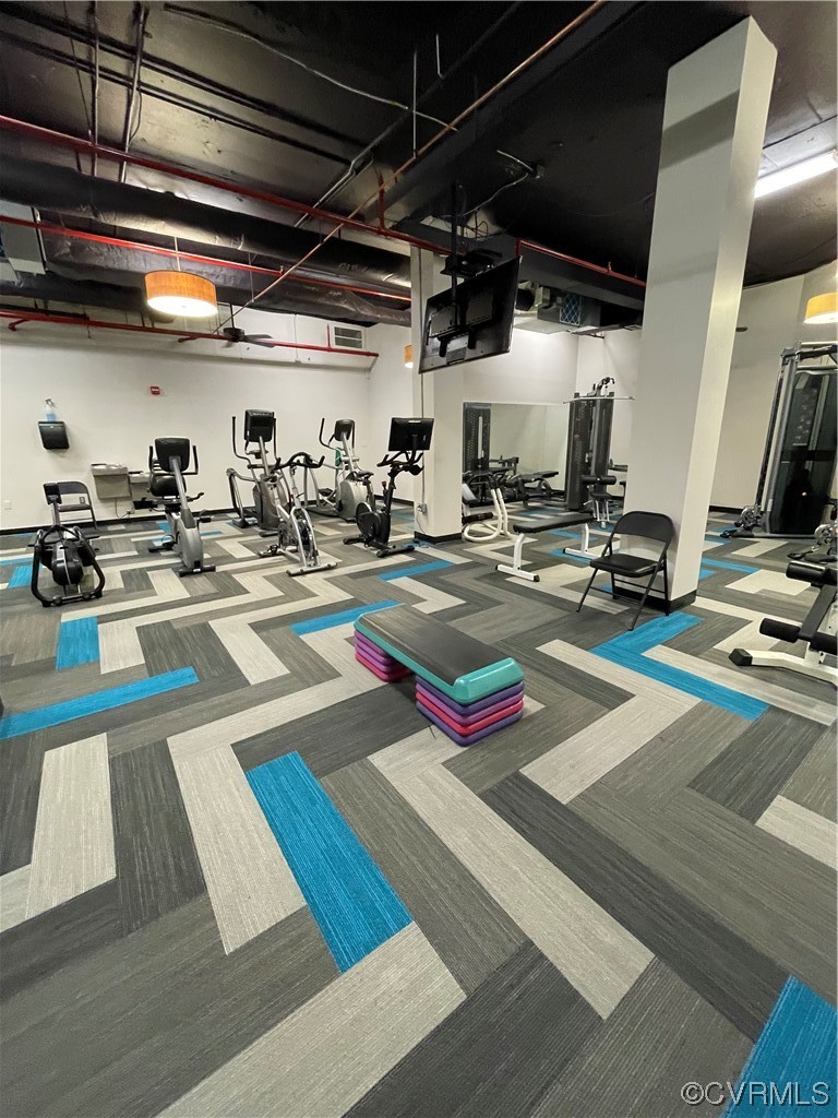 413 Stuart Circle, Unit U5E Richmond, VA 23220 - Photo 28 of 29 a room with lots of storage and a dining table