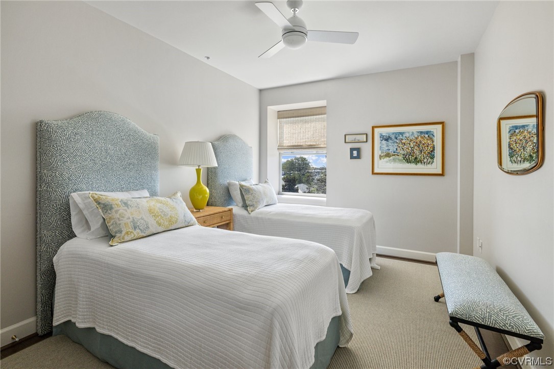 413 Stuart Circle, Unit U5E Richmond, VA 23220 - Photo 9 of 29 a bedroom with a bed and painting on the wall