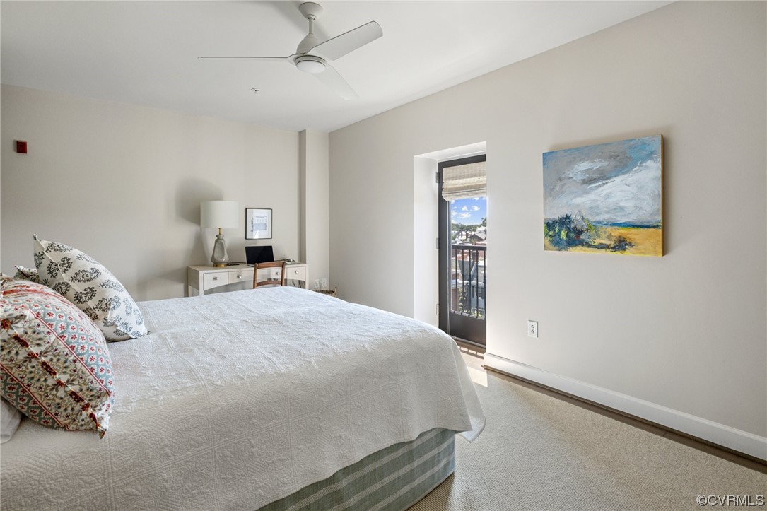 413 Stuart Circle, Unit U5E Richmond, VA 23220 - Photo 10 of 29 a bedroom with a large bed and a window