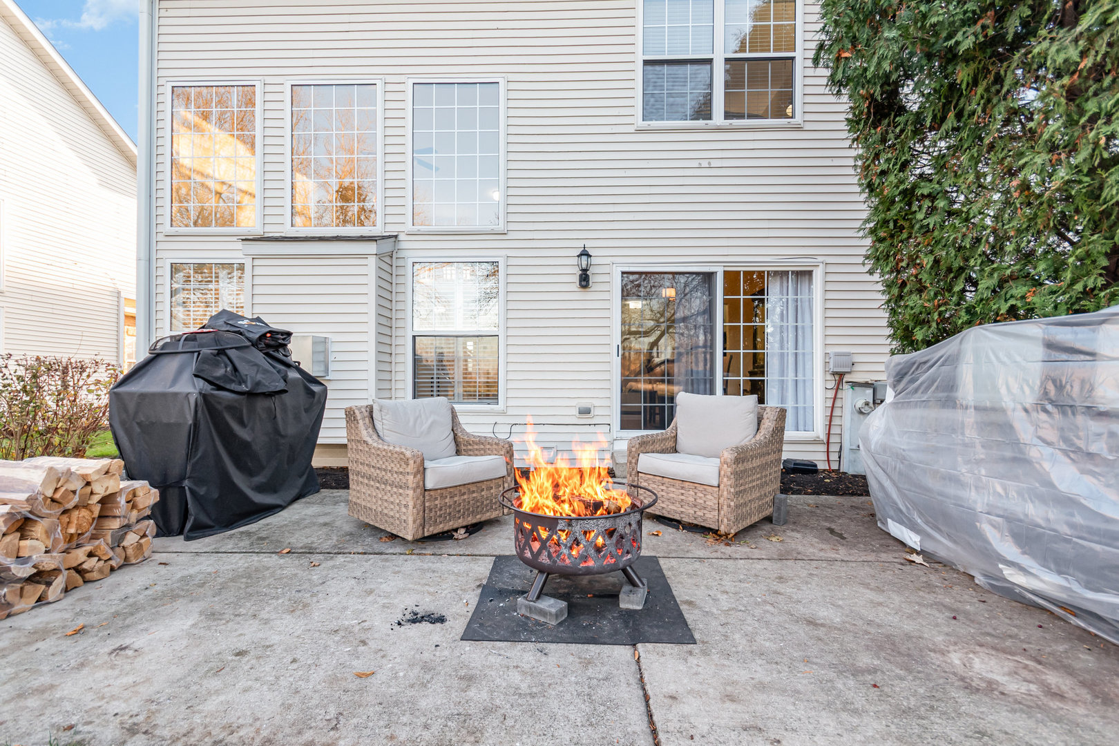 8 Lily Court Bolingbrook, IL 60440 - Photo 22 of 33 a view of a patio with couches and a fire pit