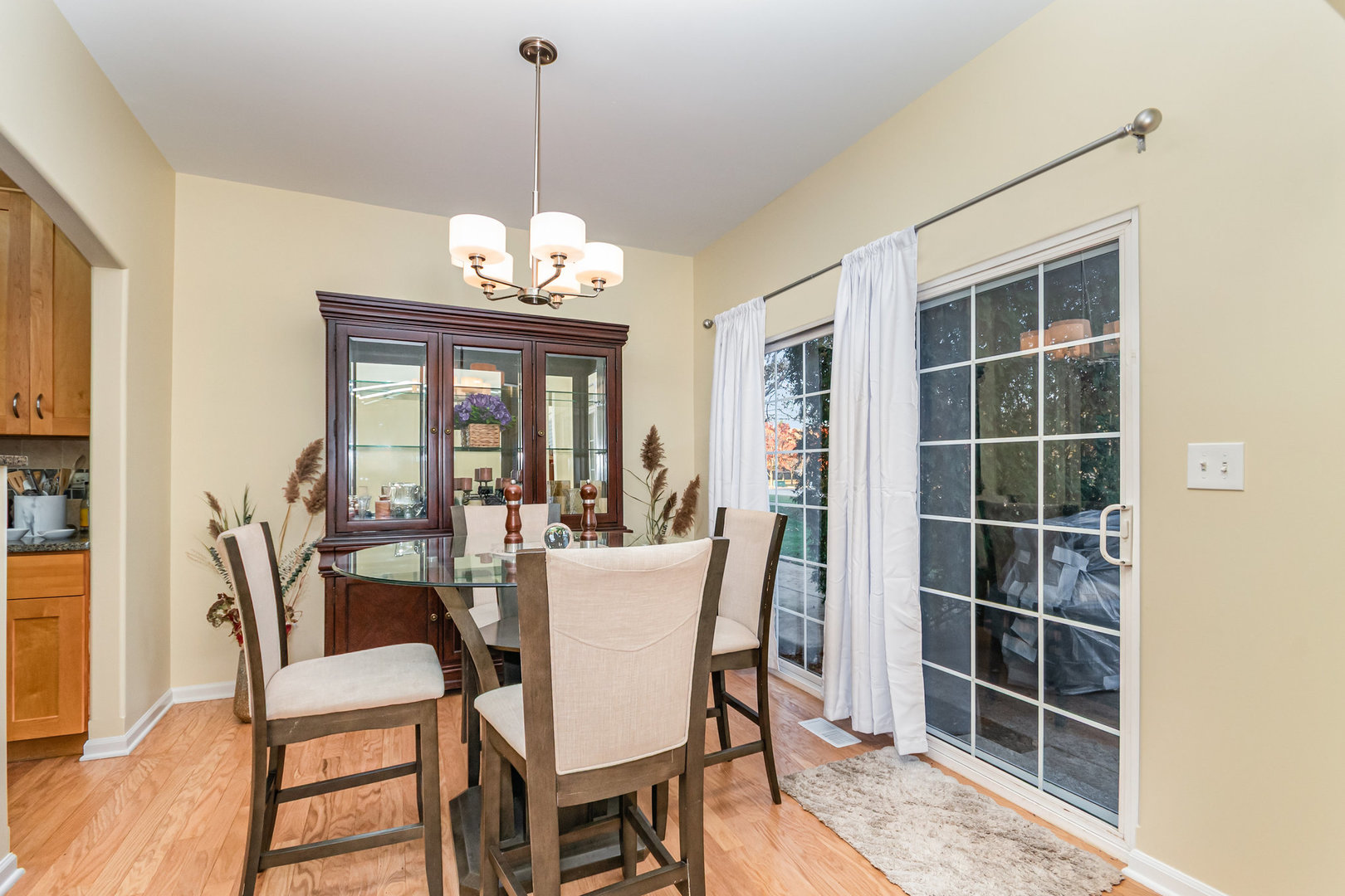8 Lily Court Bolingbrook, IL 60440 - Photo 5 of 33 a dining room with furniture window and wooden floor
