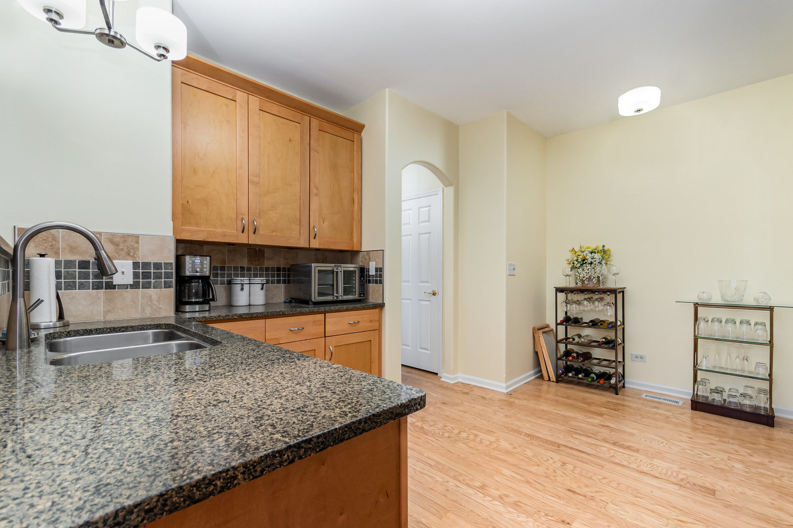 8 Lily Court Bolingbrook, IL 60440 - Photo 8 of 33 a kitchen with stainless steel appliances granite countertop a sink stove and refrigerator