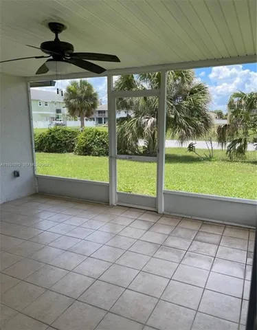 a view of a room with porch and windows