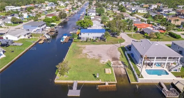 an aerial view of a house with a swimming pool