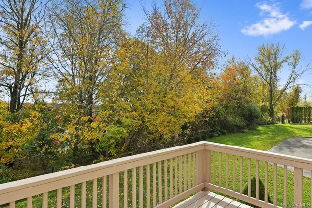 a bathroom with a granite countertop sink a toilet and a mirror