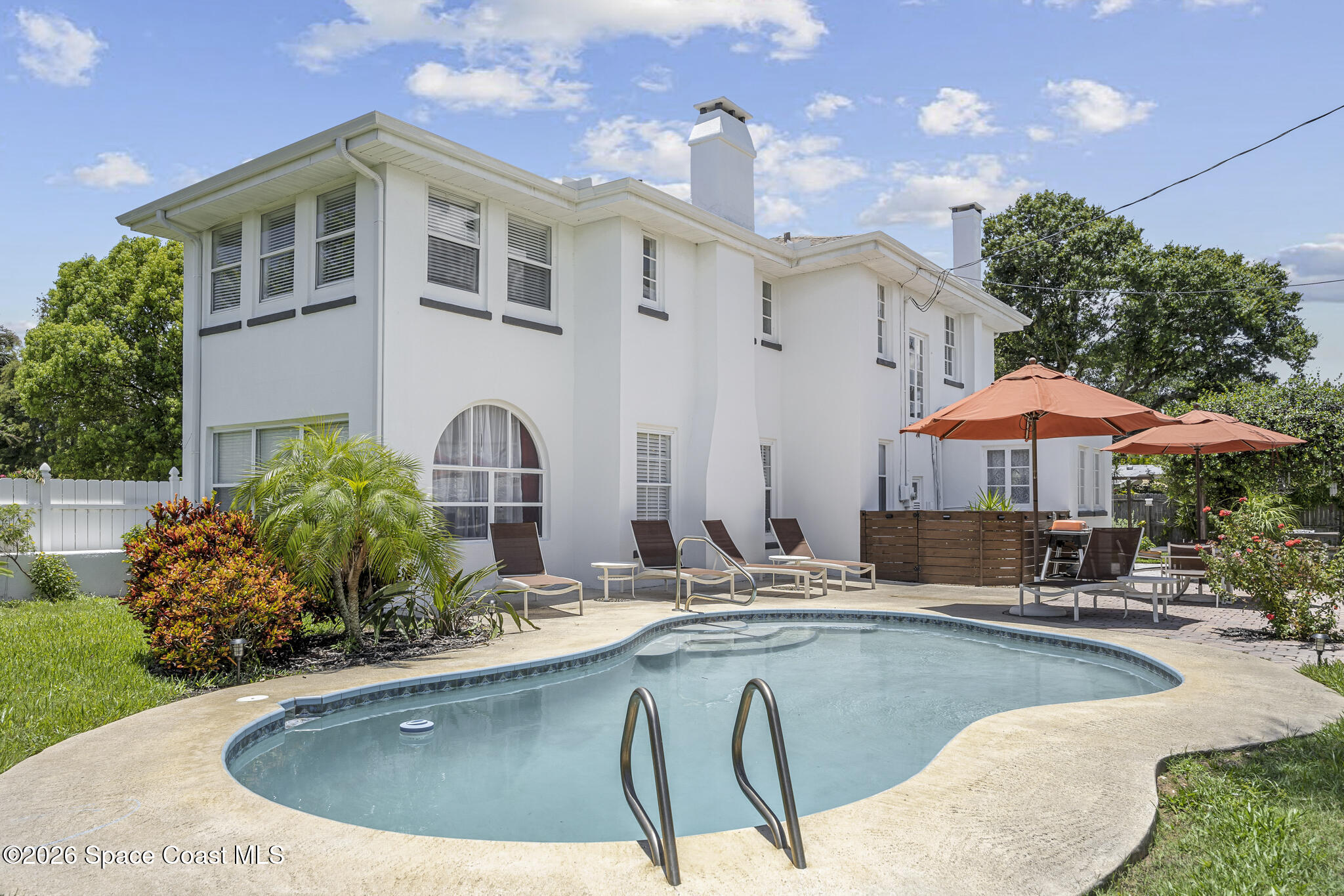 130 Valencia Road Rockledge, FL 32955 - Photo 8 of 72 a view of a house with swimming pool and sitting area