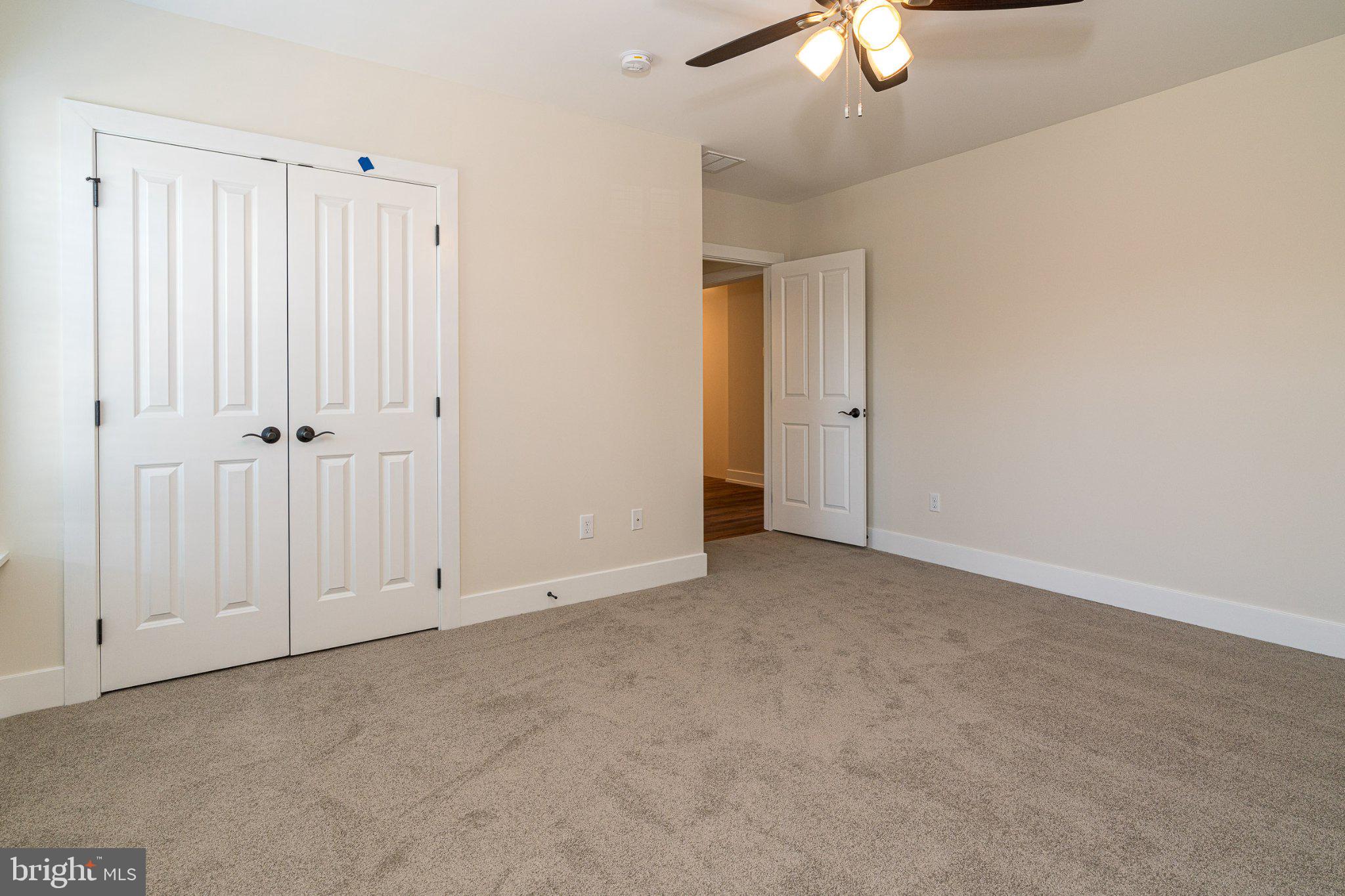 229 North High Street, Unit 3 West Chester, PA 19380 - Photo 13 of 16 an empty room with fan