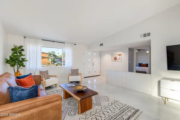 a view of room with furniture and wooden floor
