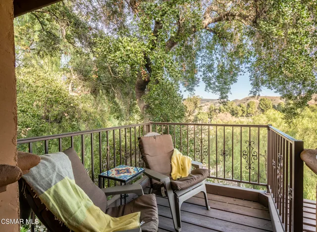 a white bath tub sitting next to a white toilet