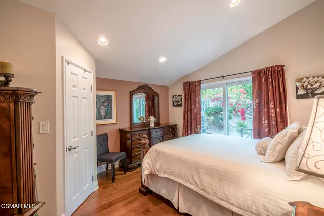 a spacious bathroom with a double vanity sink a mirror and a shower