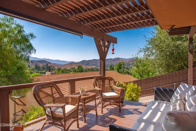 a view of a house with a yard covered in snow