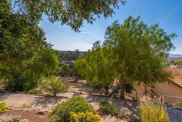 a view of a backyard with sitting area