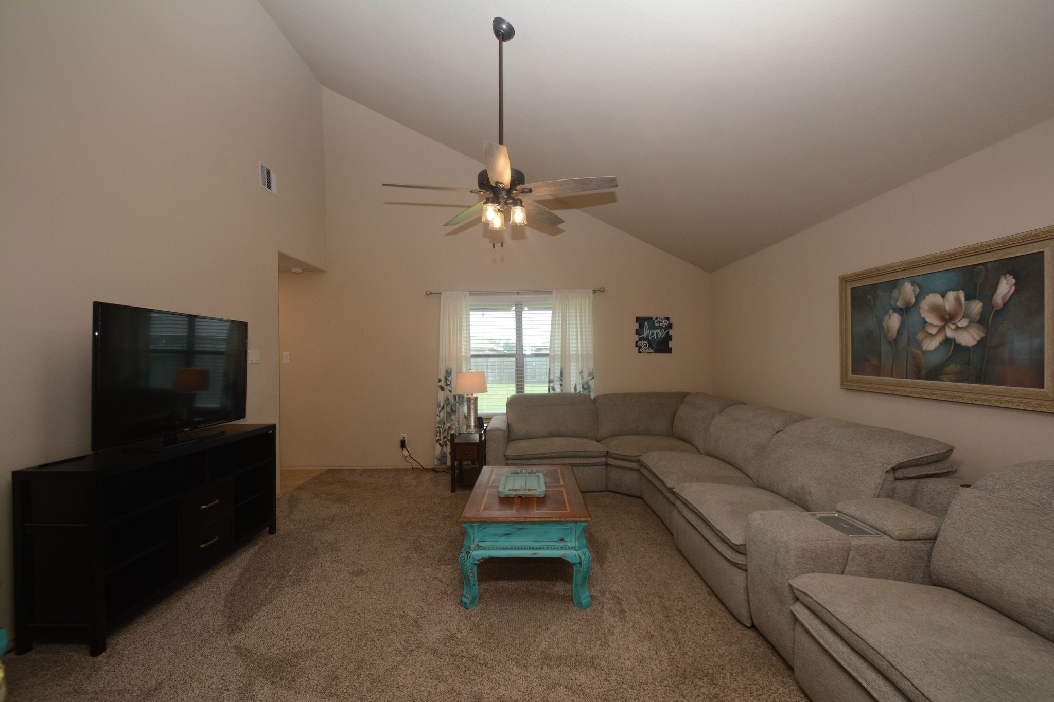23318 Dukes Run Drive Spring, TX 77373 - Photo 17 of 41 Spacious living room with high ceilings and neutral tones. Perfect for relaxation and entertainment.