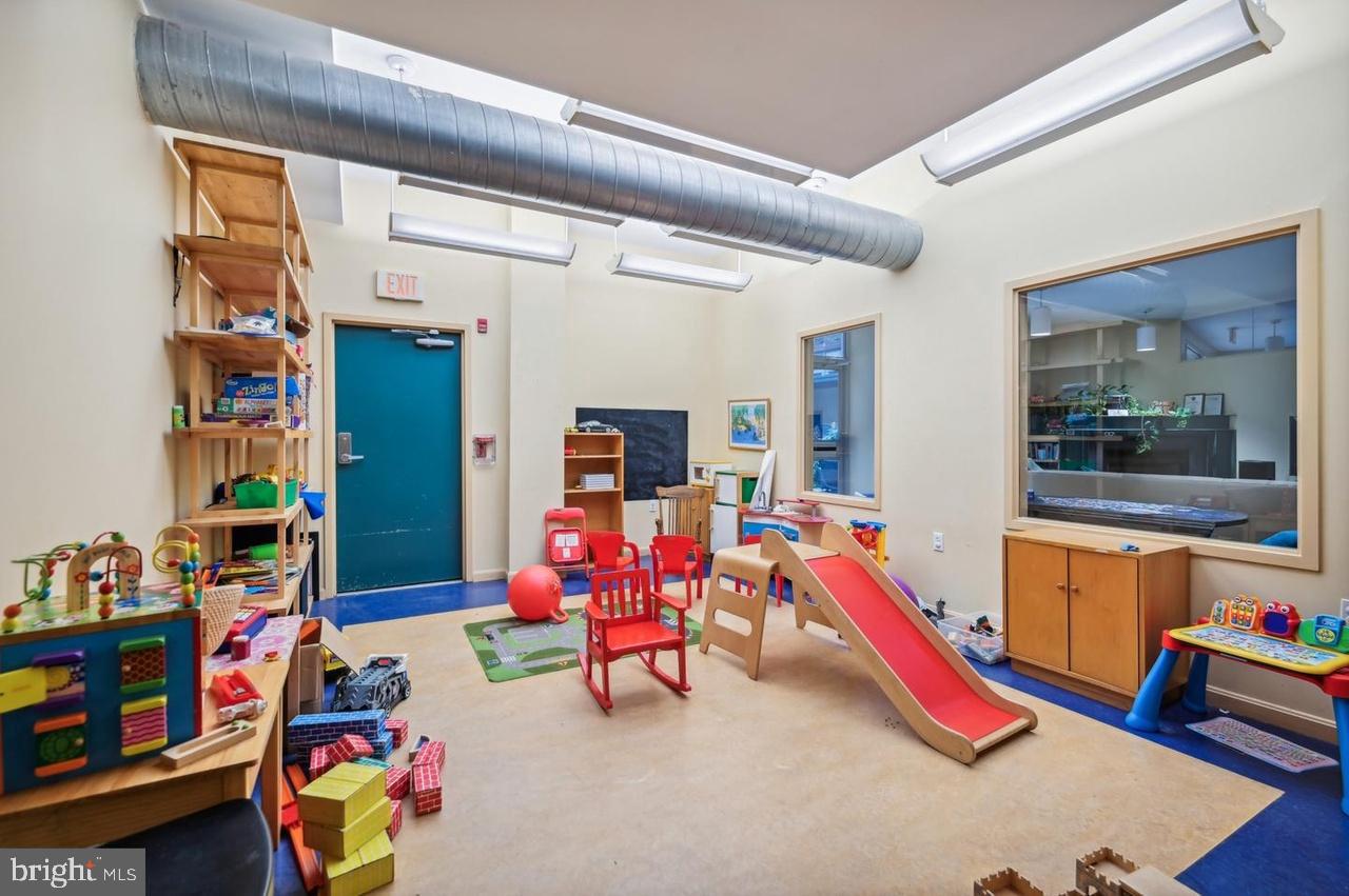 7981 Eastern Avenue Northwest, Unit 211 Silver Spring, MD 20910 - Photo 12 of 50 a play room with toys