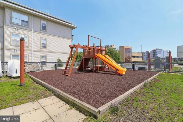 a view of swimming pool with seating space and barbeque oven