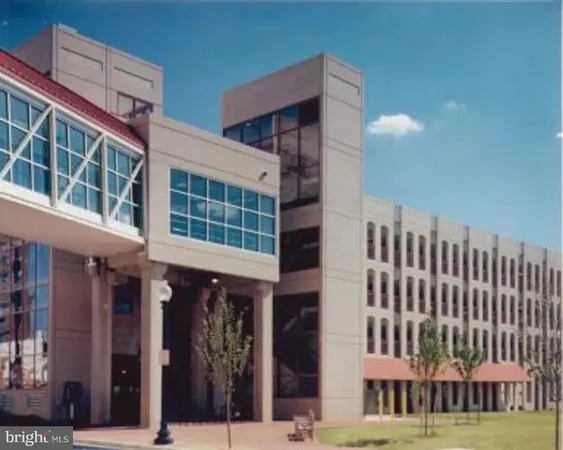 a view of room with furniture and wooden floor