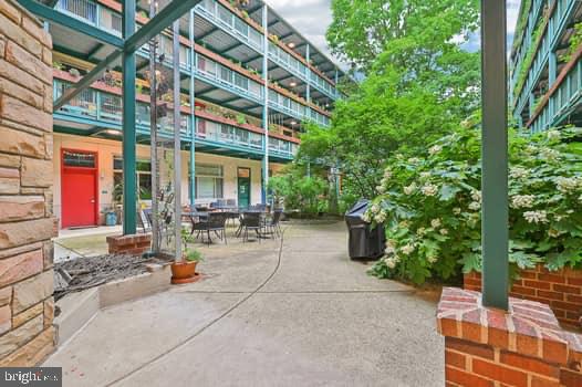 7981 Eastern Avenue Northwest, Unit 211 Silver Spring, MD 20910 - Photo 3 of 49 Charming courtyard oasis awaits you.