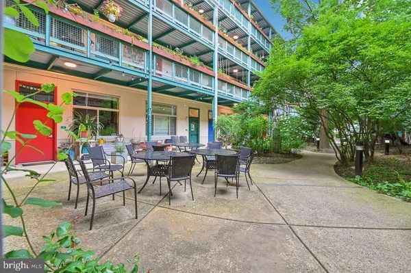 a view of a building with sitting area