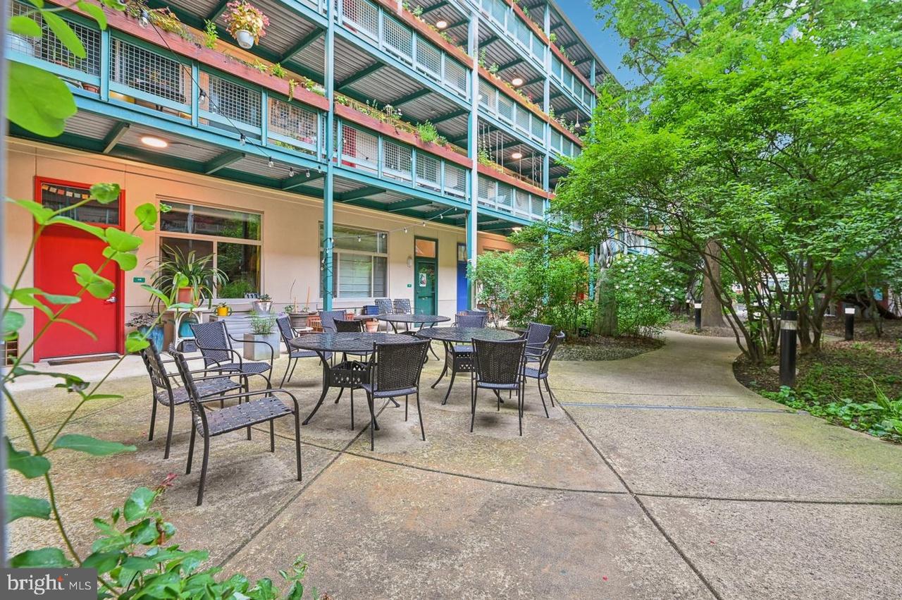 7981 Eastern Avenue Northwest, Unit 211 Silver Spring, MD 20910 - Photo 3 of 50 a view of a building with sitting area