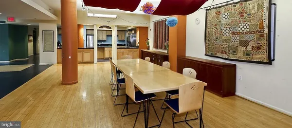 a bedroom with furniture and a large window