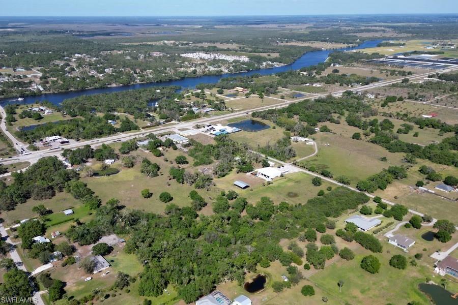 Styles Road Alva, FL 33920 - Photo 6 of 19 an aerial view of residential houses with outdoor space and trees