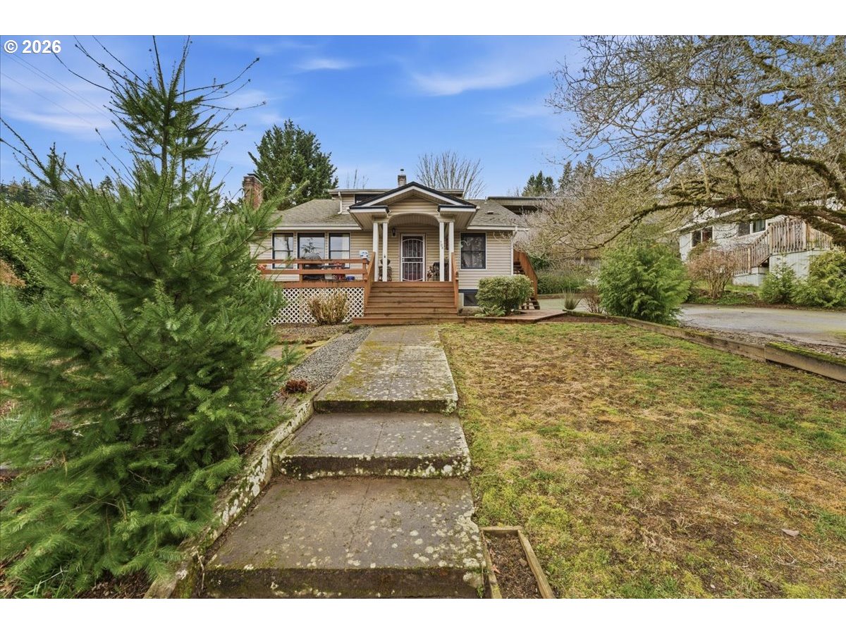 706 West B Street Rainier, OR 97048 - Photo 2 of 47 a front view of a house with a yard