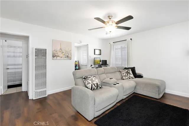 a bed room with a bed and a ceiling fan