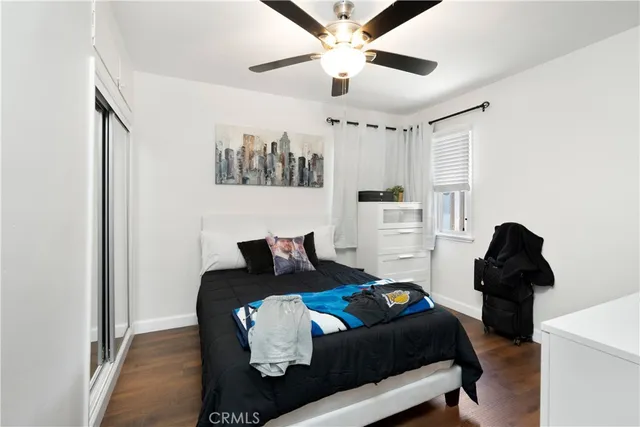 a bedroom with furniture and a chandelier