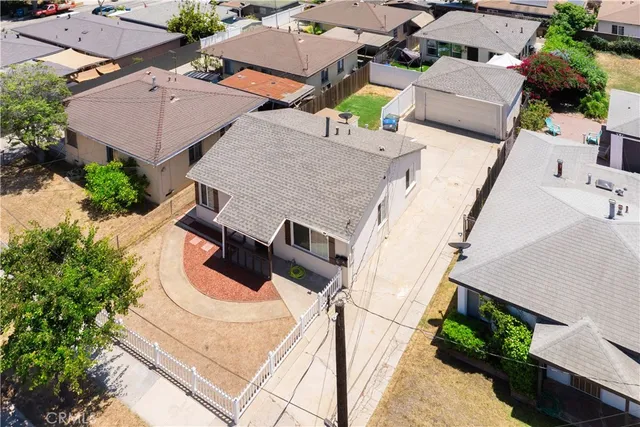 an aerial view of a house with swimming pool and outdoor space