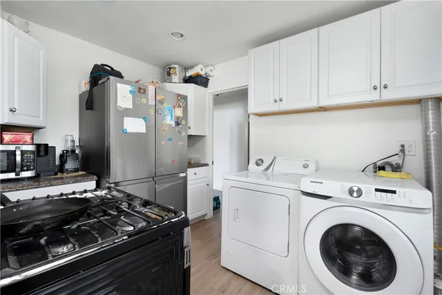 a kitchen with a stove and a refrigerator